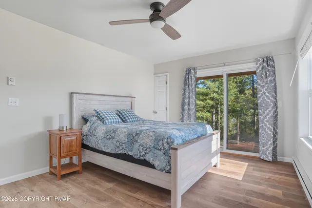 a bedroom with a bed and cabinet