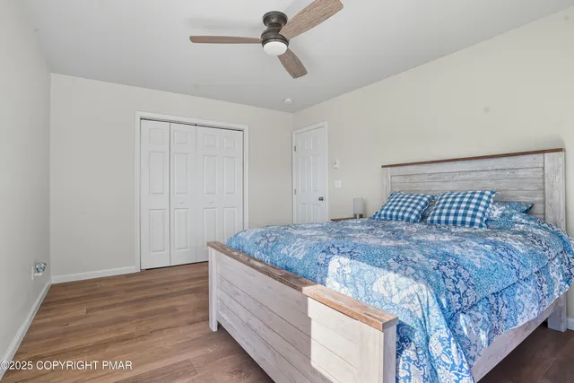 a view of balcony with wooden floor and fence