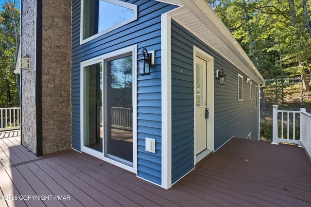 a view of balcony with wooden floor