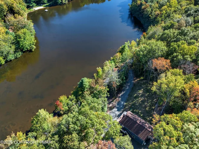 a view of a lake with a yard