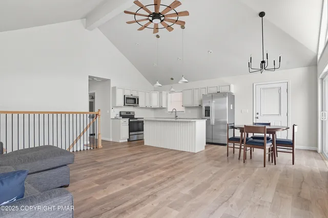 a view of kitchen with sink and window