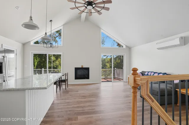a view of a livingroom with furniture window and wooden floor
