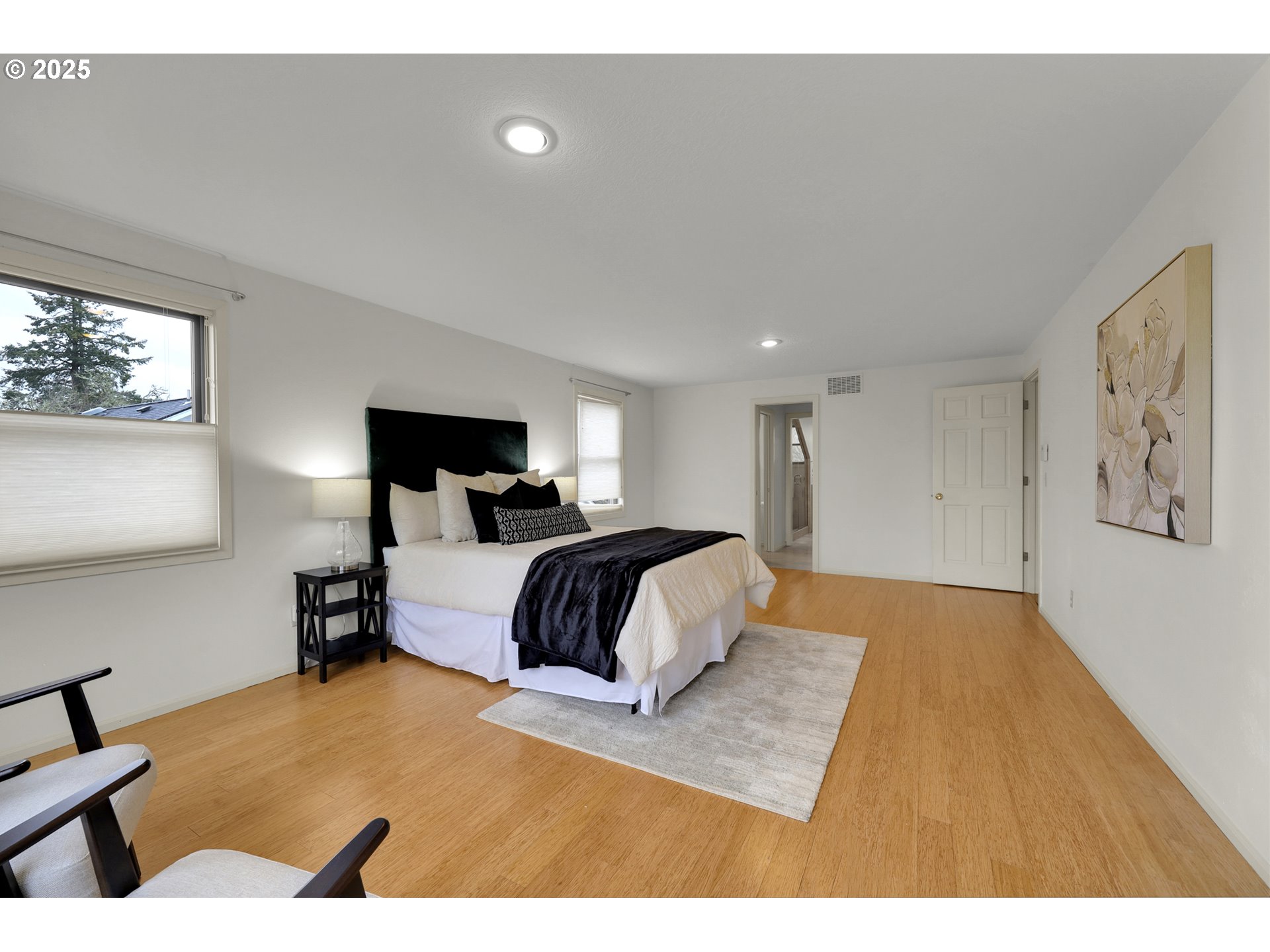 5147 Solar Heights Drive Eugene, OR 97405 - Photo 19 of 29 a bedroom with a large bed and a couch