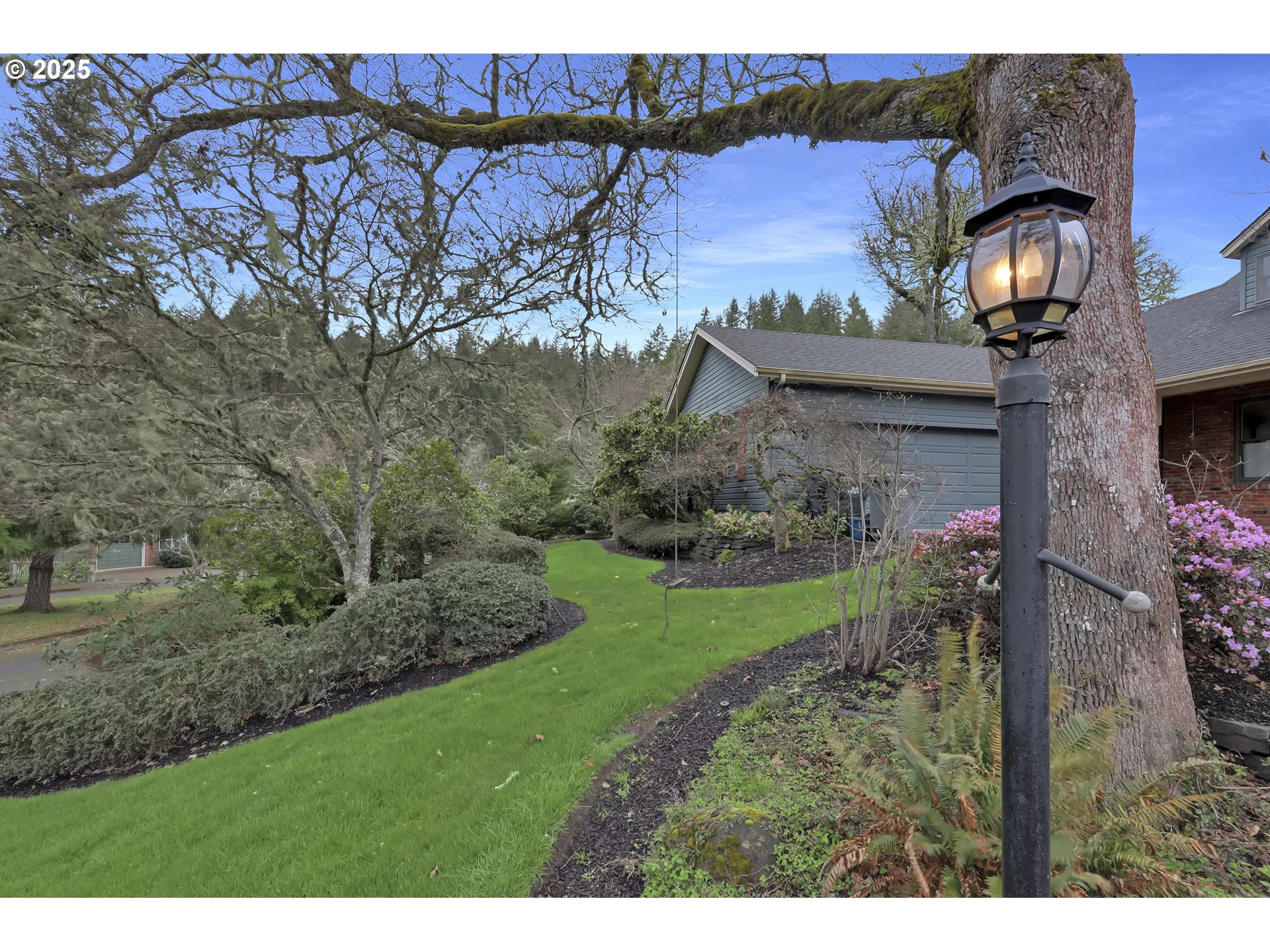 5147 Solar Heights Drive Eugene, OR 97405 - Photo 2 of 29 a view of a house with a yard and a fountain