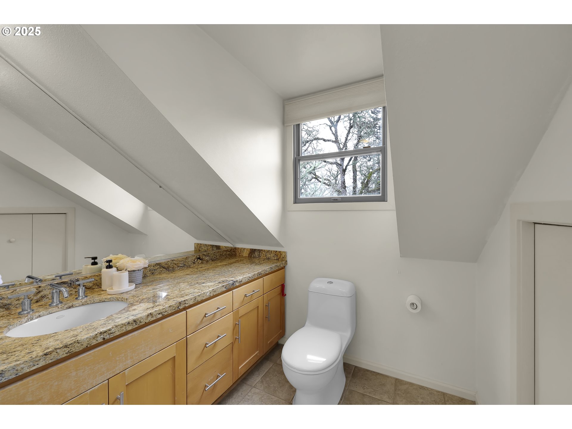 5147 Solar Heights Drive Eugene, OR 97405 - Photo 23 of 29 a bathroom with a granite countertop toilet a sink and mirror