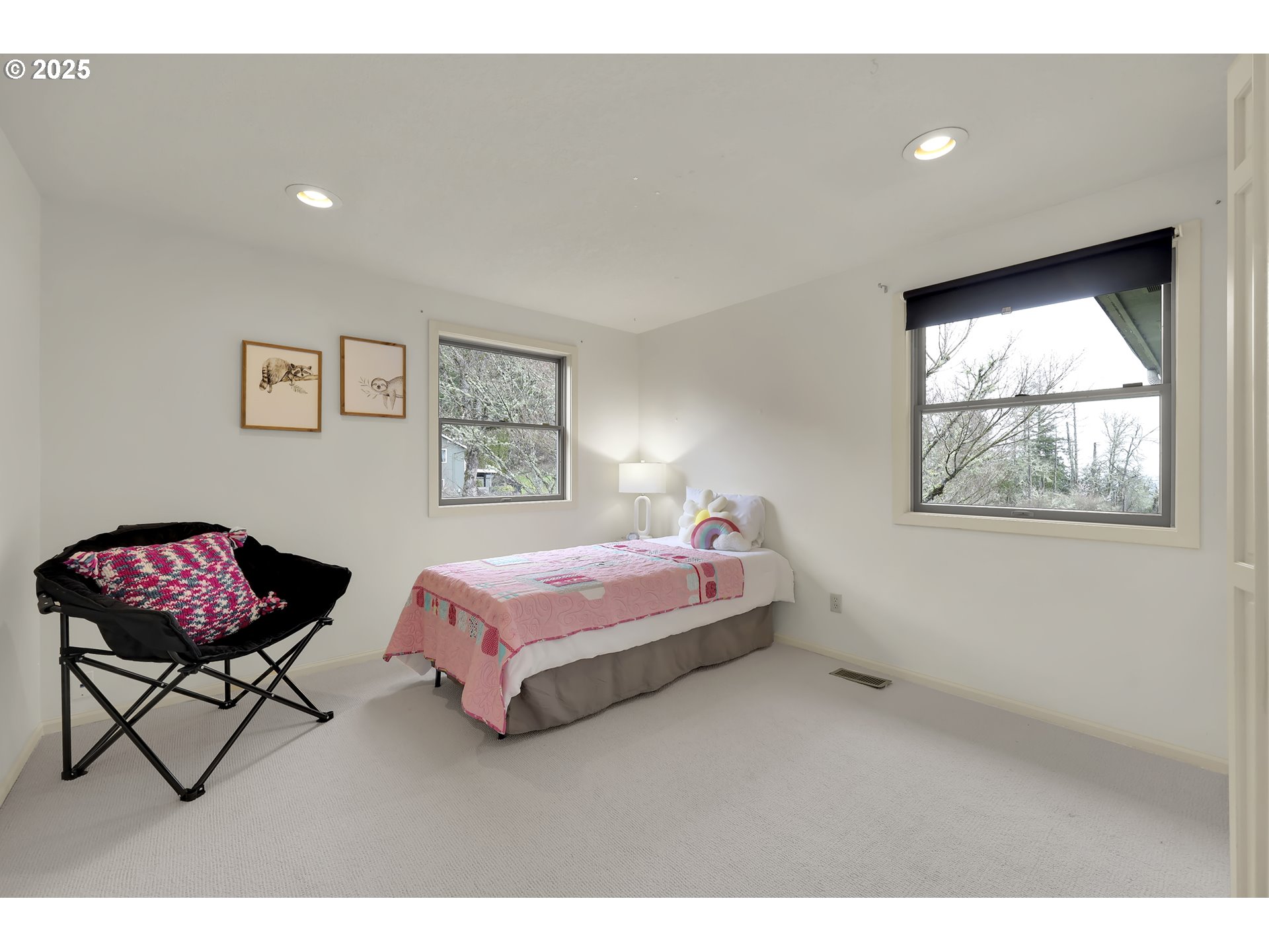 5147 Solar Heights Drive Eugene, OR 97405 - Photo 24 of 29 a bedroom with a bed and a painting on the wall