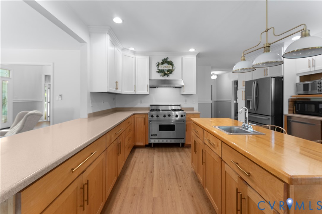 437 Plainview Road Kinsale, VA 22488 - Photo 17 of 63 a kitchen with kitchen island granite countertop lots of counter top space and stainless steel appliances
