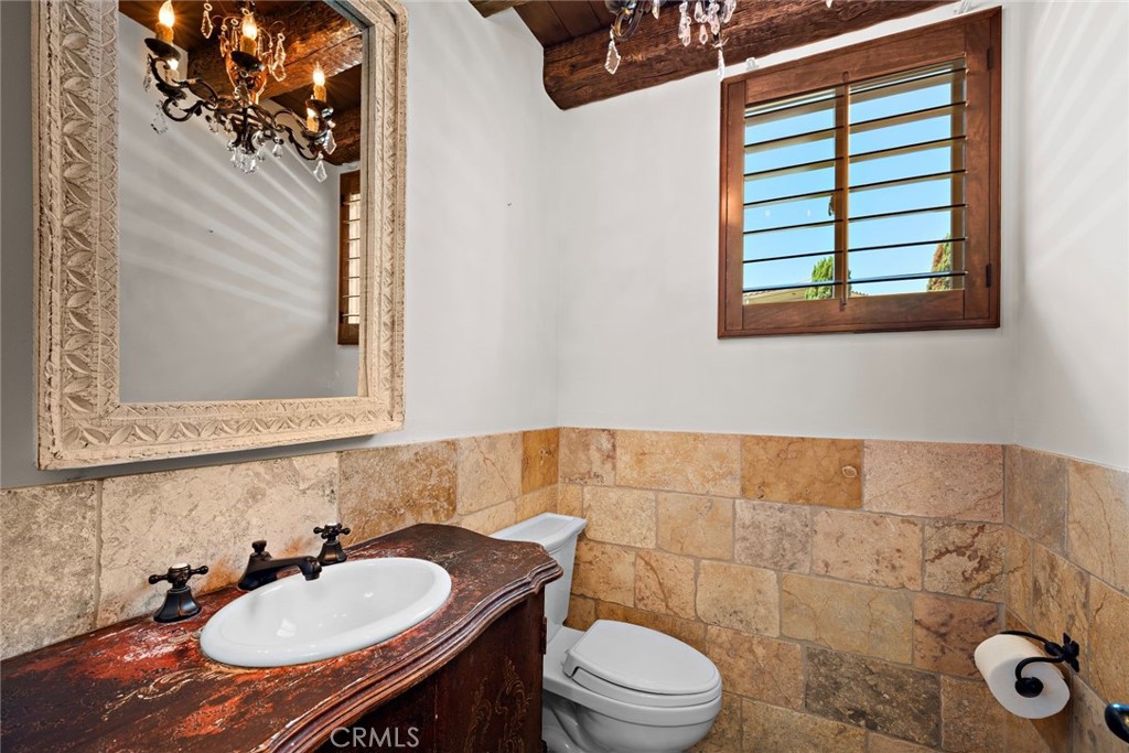 5 Via Monarca Street Dana Point, CA 92629 - Photo 35 of 57 a bathroom with a sink toilet a mirror and shower