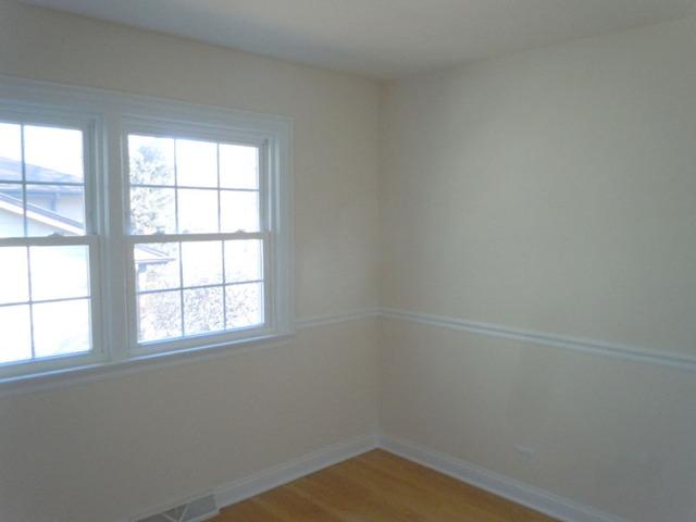 1752 East Corktree Lane Mount Prospect, IL 60056 - Photo 12 of 20 an empty room with a window