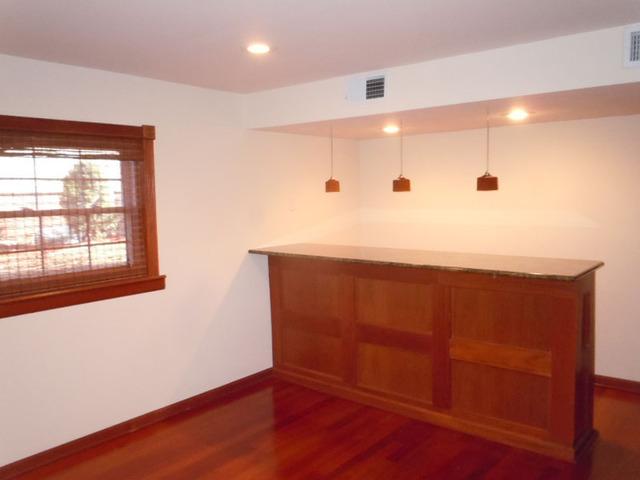 1752 East Corktree Lane Mount Prospect, IL 60056 - Photo 16 of 20 a bathroom with a sink a mirror and a window