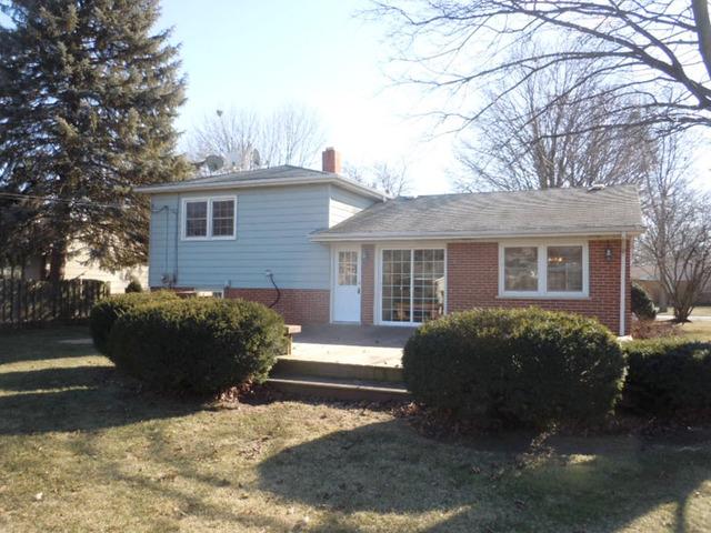 1752 East Corktree Lane Mount Prospect, IL 60056 - Photo 20 of 20 a view of a house with a yard covered in snow