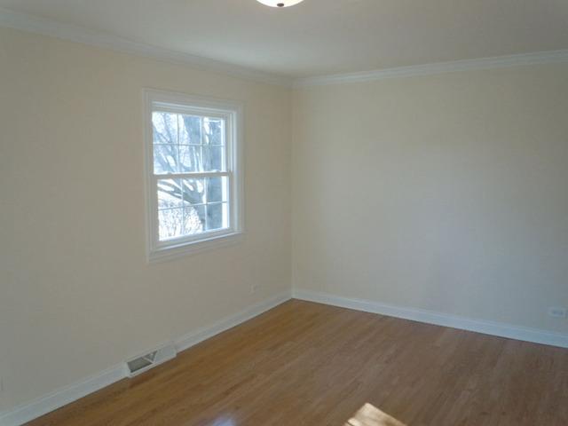 1752 East Corktree Lane Mount Prospect, IL 60056 - Photo 8 of 20 an empty room with a window