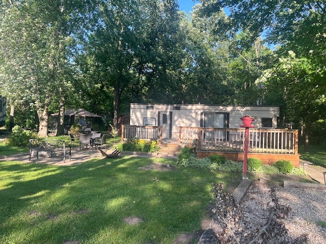 2795 East 28th Road Marseilles, IL 61341 - Photo 1 of 57 a view of a chair and tables in the garden