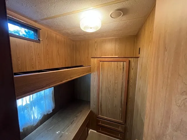 a bathroom with a sink and mirror with toilet