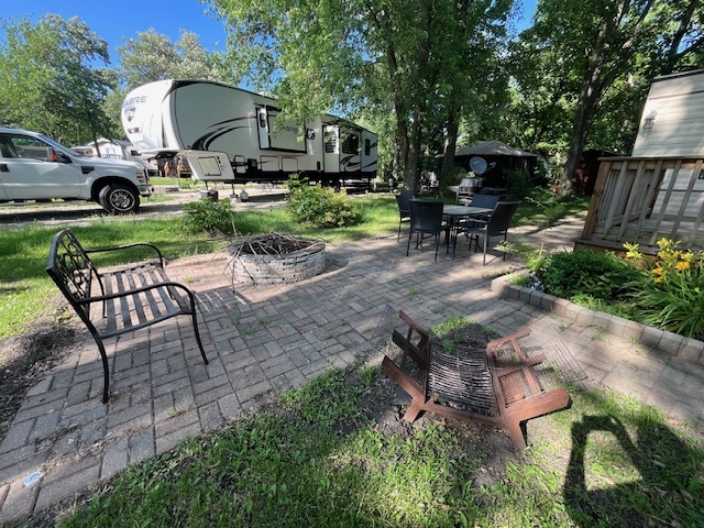 2795 East 28th Road Marseilles, IL 61341 - Photo 15 of 57 a view of backyard with sitting area and garden