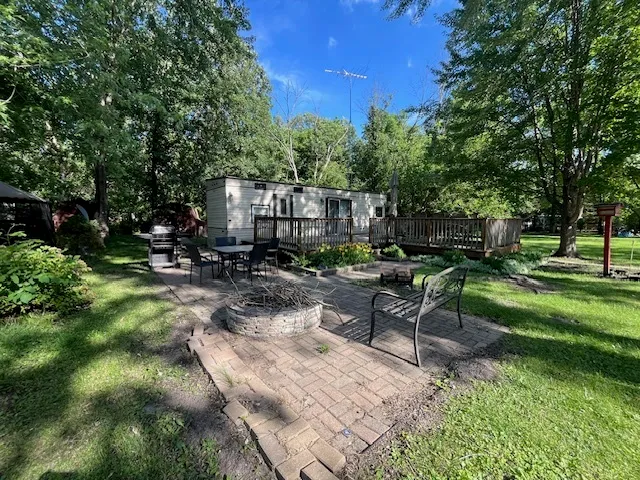 a view of a backyard with sitting area and outdoor space