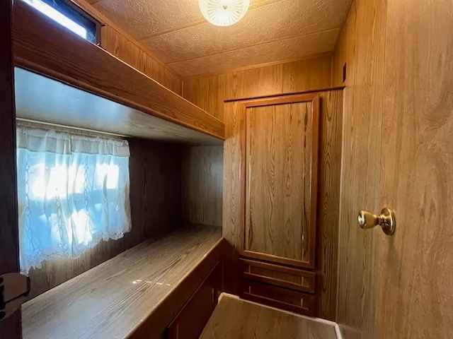 a view of a hallway with windows