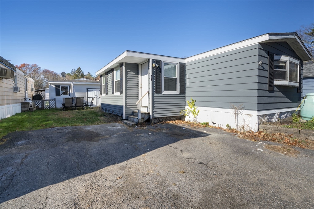 75 South Policy Street, Unit 48 Salem, NH 03079 - Photo 1 of 36 a view of a house with a yard