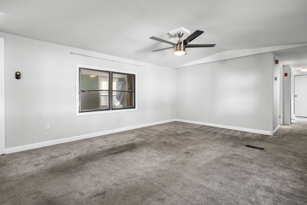 75 South Policy Street, Unit 48 Salem, NH 03079 - Photo 2 of 36 a view of an empty room with a window