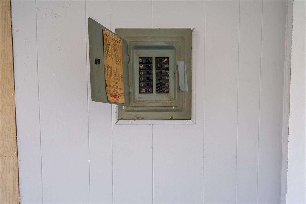 75 South Policy Street, Unit 48 Salem, NH 03079 - Photo 35 of 36 a yellow house with a sink