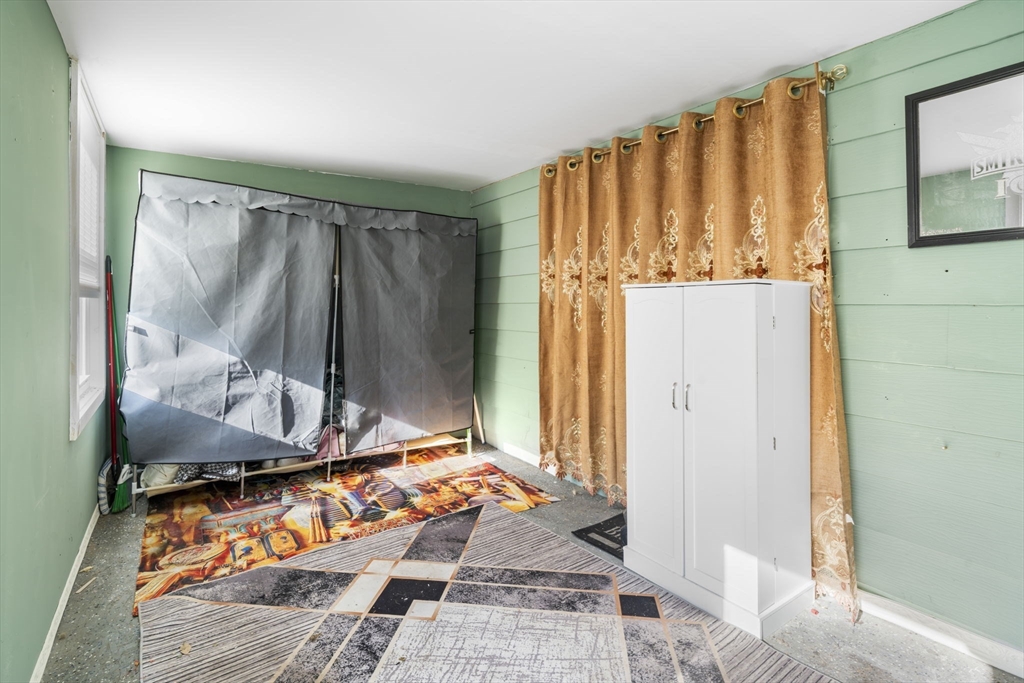 75 South Policy Street, Unit 48 Salem, NH 03079 - Photo 6 of 36 a bedroom with a bed and a window