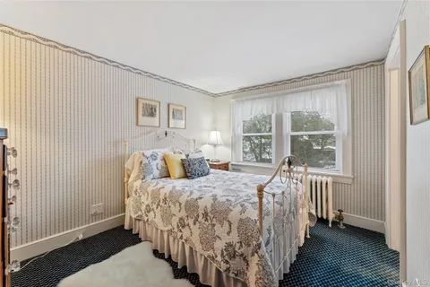 a bed room with a bed and a window