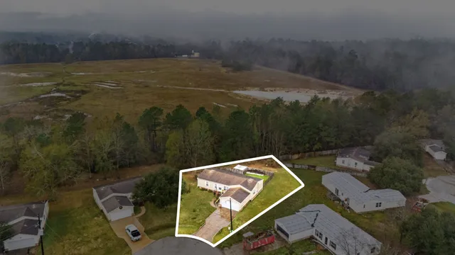 a view of a swimming pool with a yard