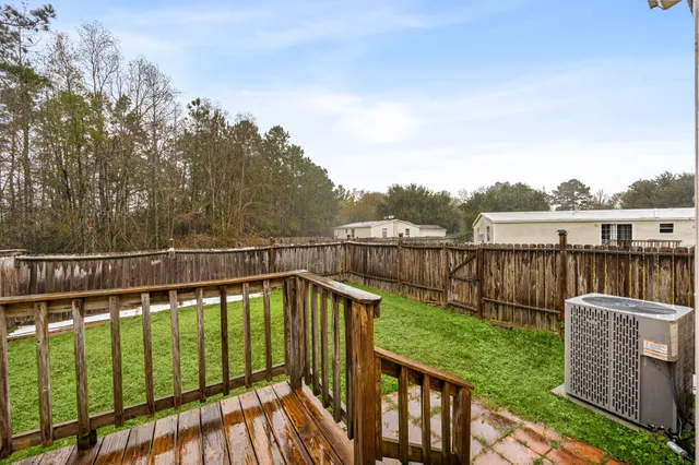 a view of a wooden deck with a garden