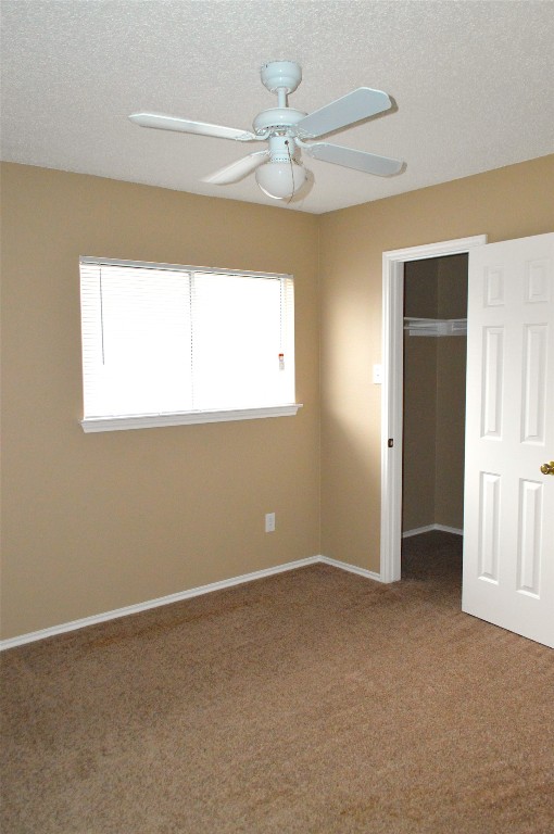 2014 Carriage Club Drive Cedar Park, TX 78613 - Photo 14 of 19 an empty room with a window and a chandelier fan
