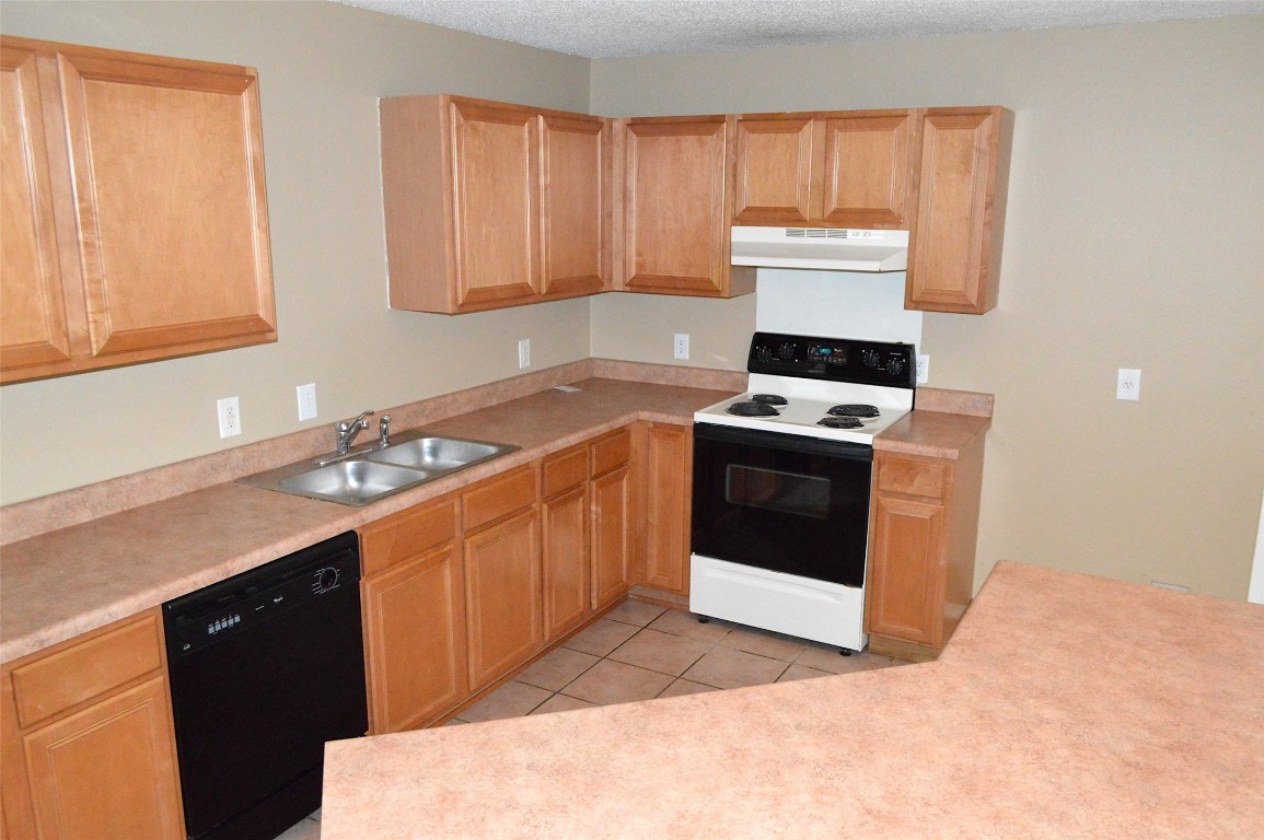2014 Carriage Club Drive Cedar Park, TX 78613 - Photo 2 of 19 a kitchen with a stove sink and cabinets