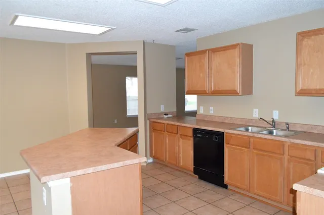 a kitchen with a sink and cabinets