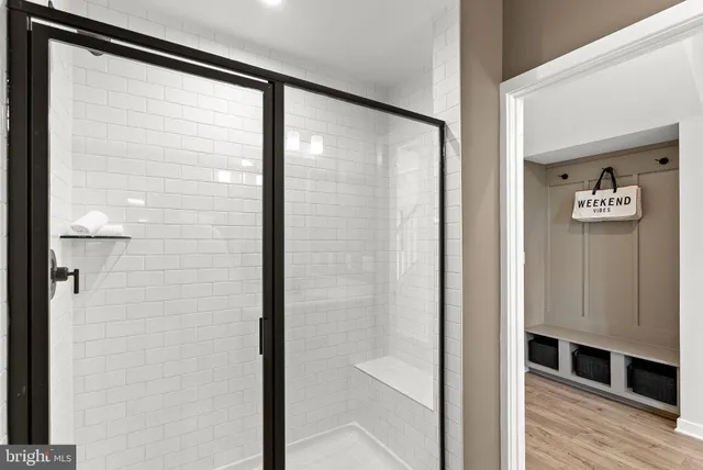 a bathroom with a glass shower door