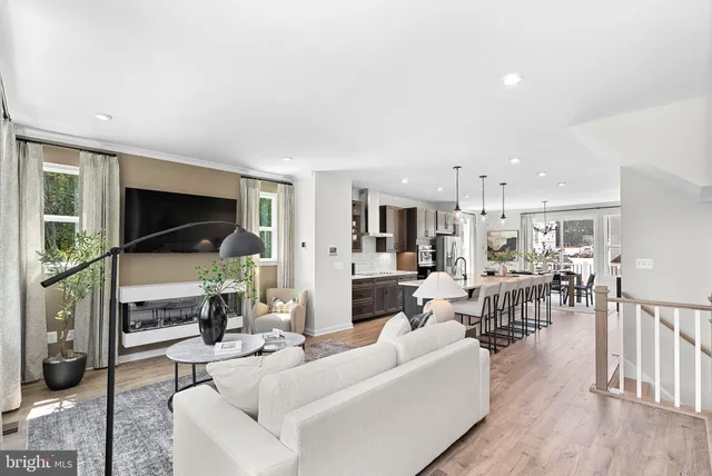 a living room with fireplace furniture and a flat screen tv