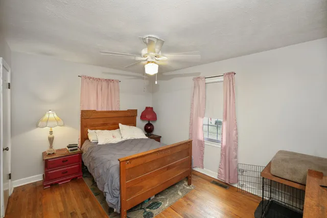 a bed room with a bed and a chandelier
