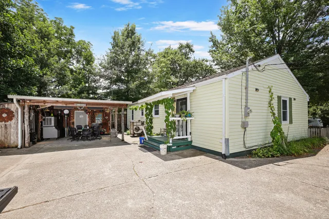 a view of a car park in front of house