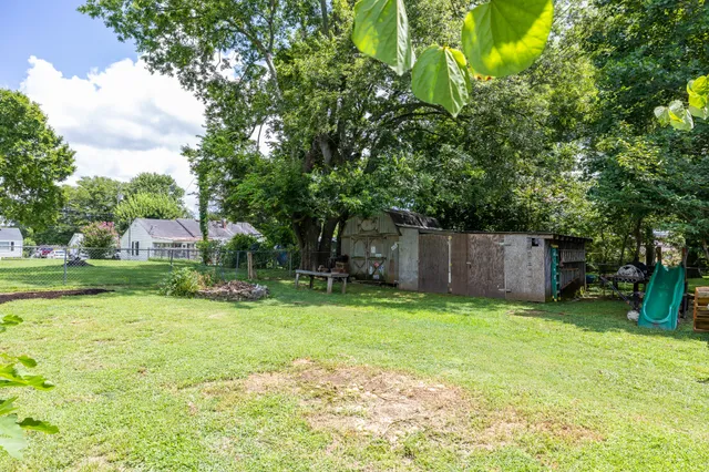 a view of a house with a yard porch and sitting area