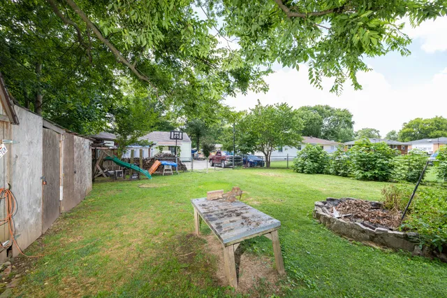 a backyard of a house with lots of green space