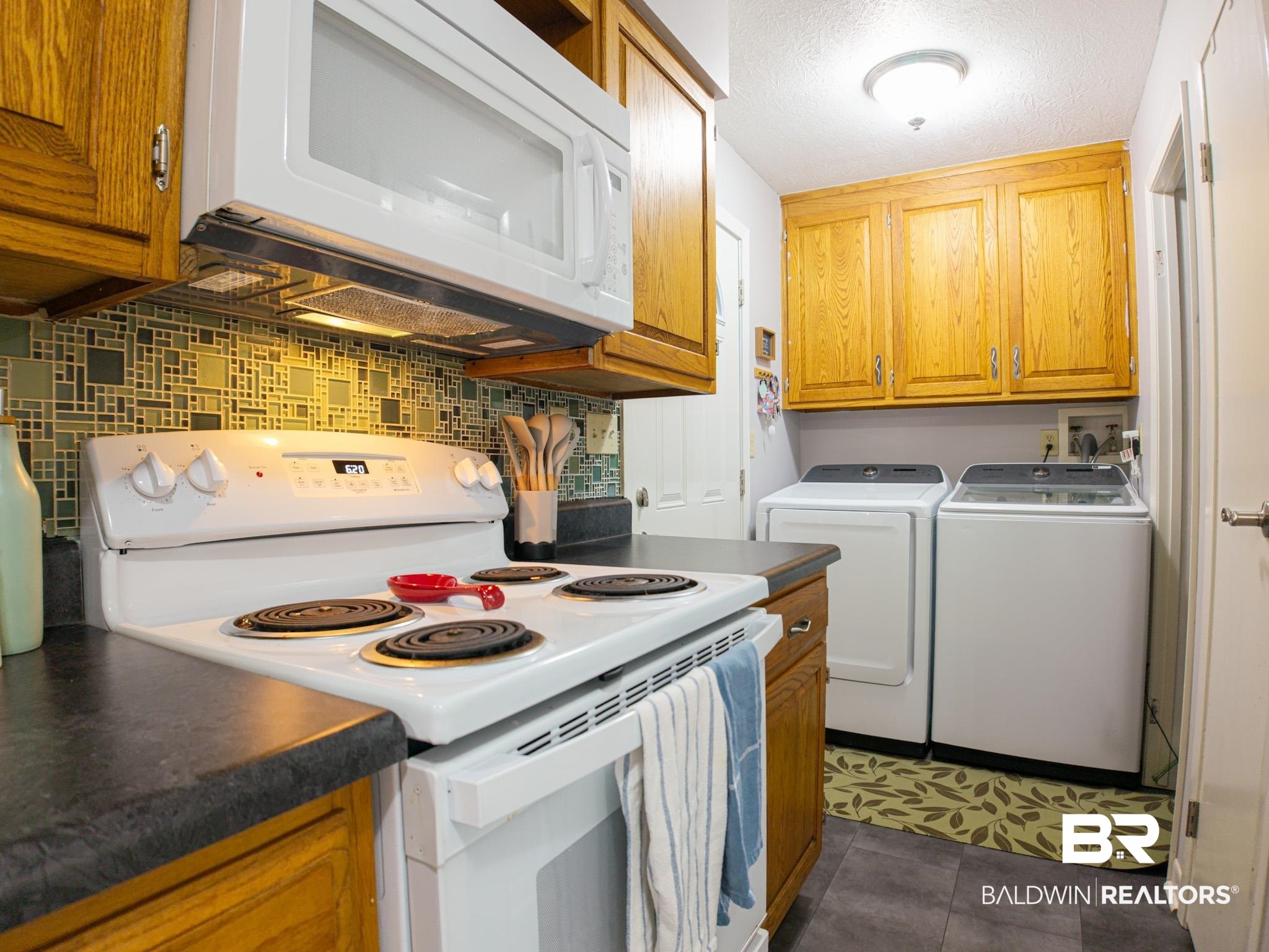 1563 Valencia Drive Lillian, AL 36549 - Photo 9 of 27 Laundry room with independent washer and dryer