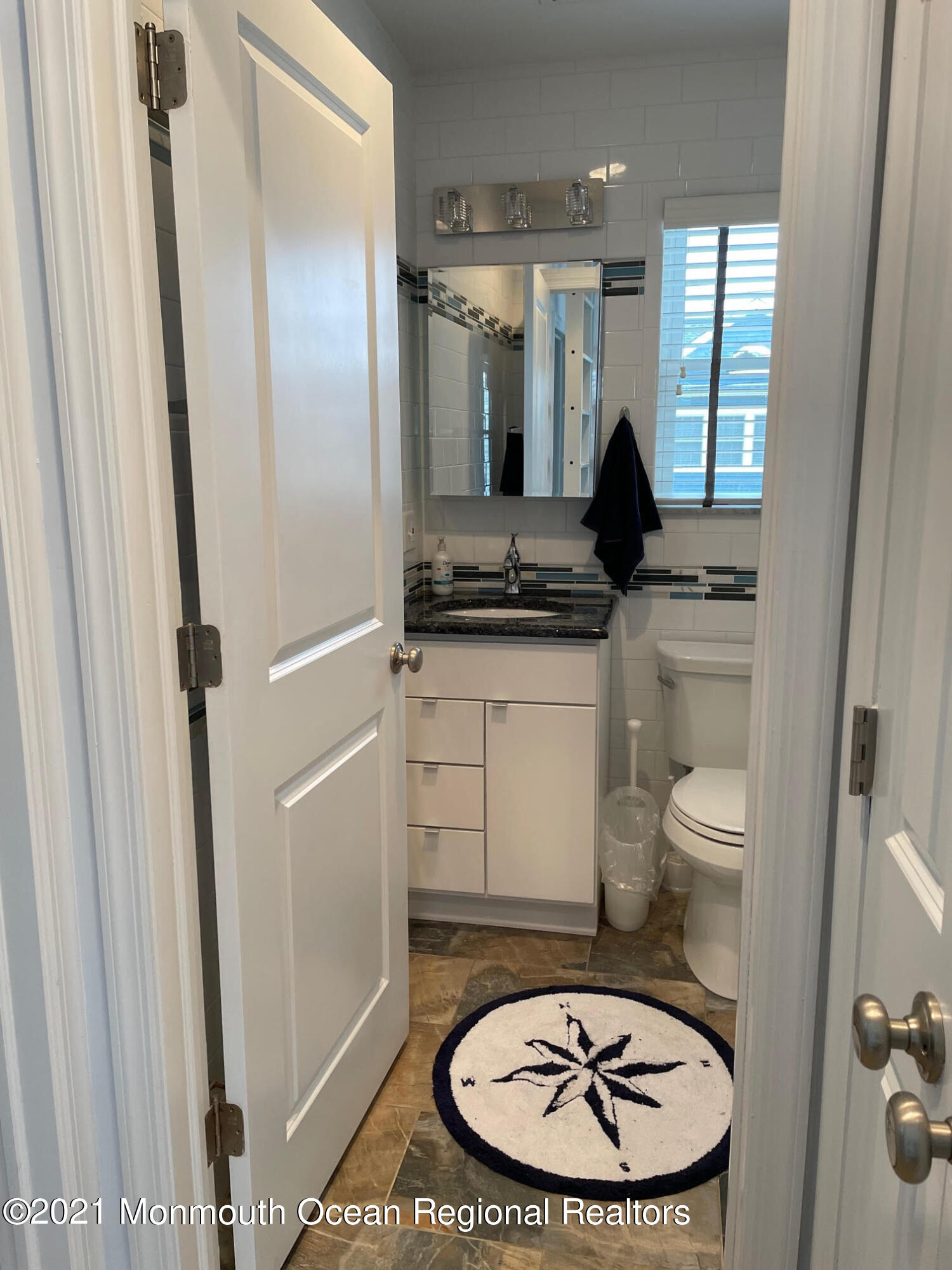 106 West Pompano Way Lavallette, NJ 08735 - Photo 15 of 27 a bathroom with a granite countertop toilet a sink and a mirror