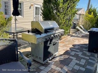 106 West Pompano Way Lavallette, NJ 08735 - Photo 19 of 27 a view of a fire pit with wooden fence