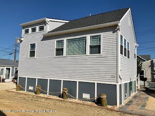 106 West Pompano Way Lavallette, NJ 08735 - Photo 25 of 27 a front view of a house with garage