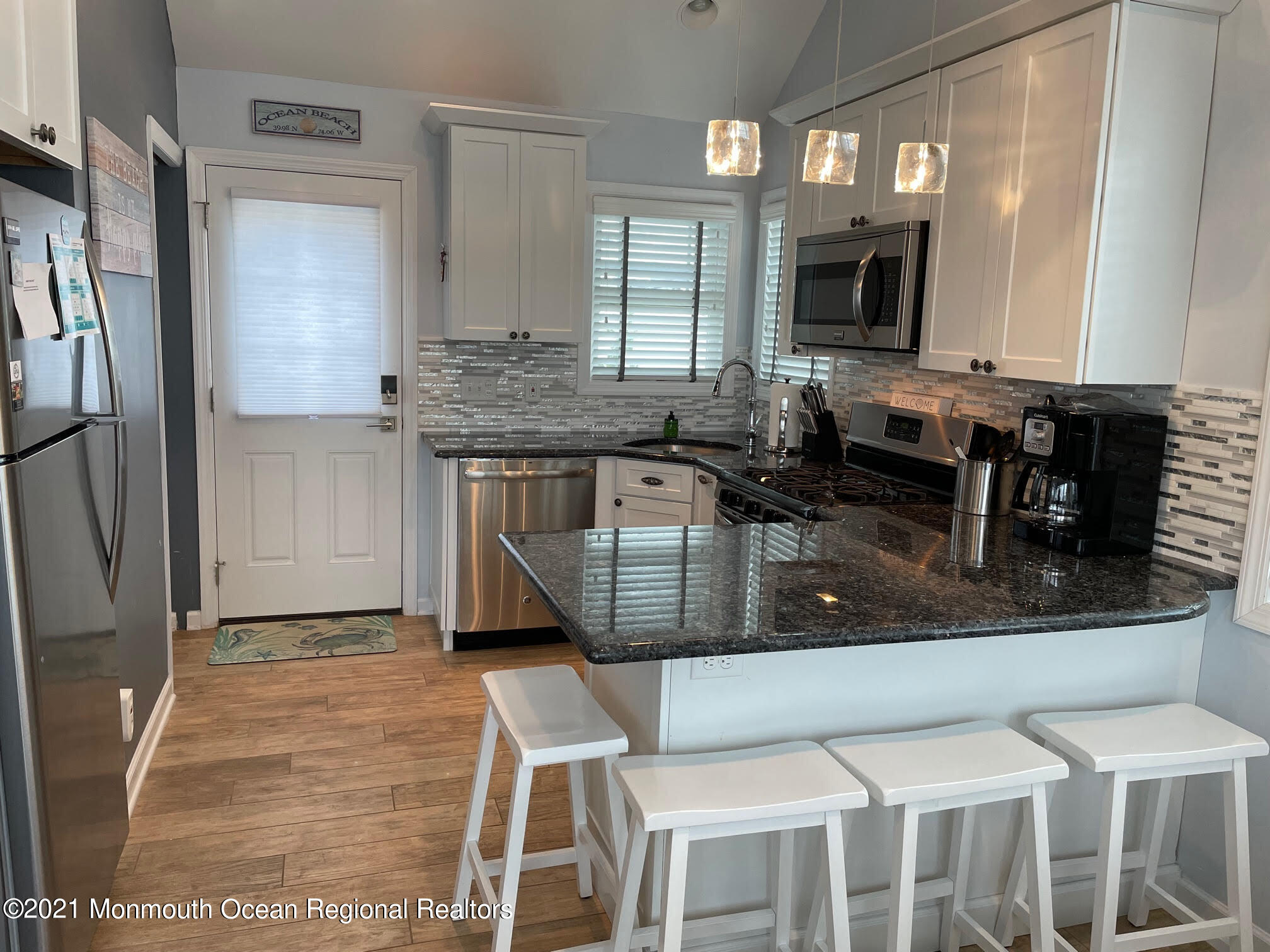 106 West Pompano Way Lavallette, NJ 08735 - Photo 3 of 27 a kitchen with stainless steel appliances granite countertop a stove a sink and a microwave