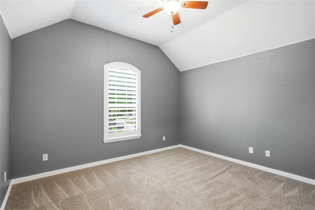 5201 Geode Lane McKinney, TX 75072 - Photo 28 of 37 Secondary bedroom with beautiful slate color designer paint.