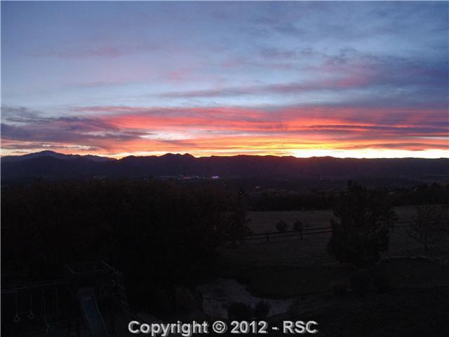 14665 Sterling Road Colorado Springs, CO 80921 - Photo 25 of 25 Sunset from the Deck with the Air Force Academy Lights