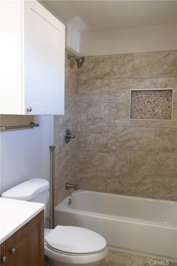 2412 Strong Avenue Commerce, CA 90040 - Photo 3 of 6 a bathroom with a toilet and a bathtub