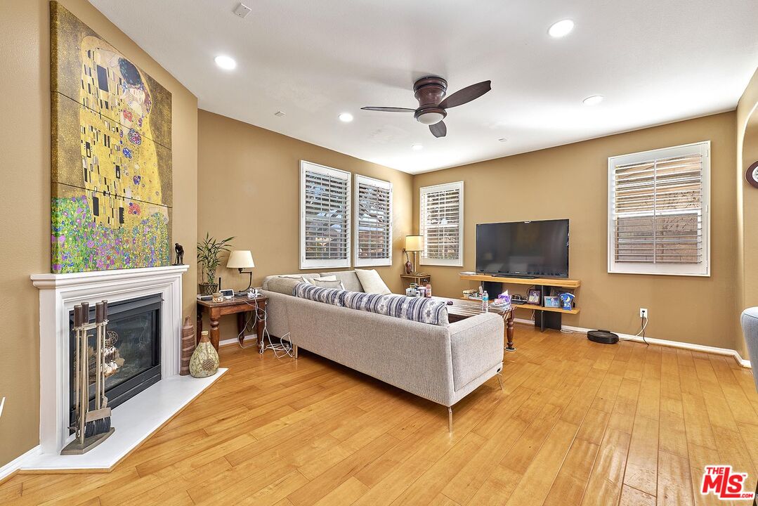 409 Spring Park Road Camarillo, CA 93012 - Photo 3 of 31 a living room with furniture fireplace and a flat screen tv