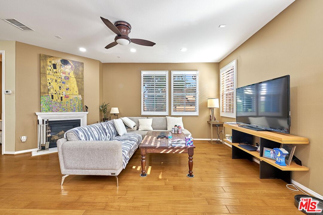 409 Spring Park Road Camarillo, CA 93012 - Photo 4 of 31 a living room with furniture and a flat screen tv