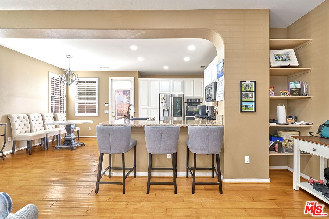 409 Spring Park Road Camarillo, CA 93012 - Photo 6 of 31 a dining room with furniture and wooden floor