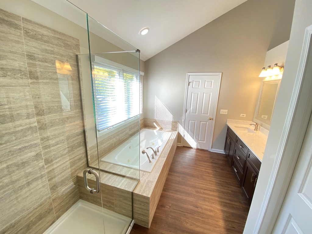 2428 Ridgewood Court Aurora, IL 60502 - Photo 21 of 40 a view of a hallway with wooden floor and staircase