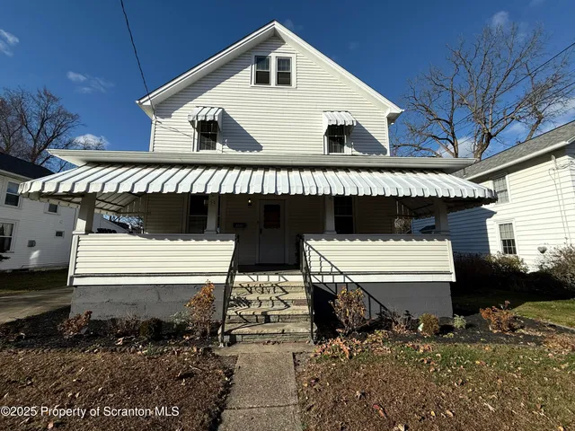 a front view of a house with a garage